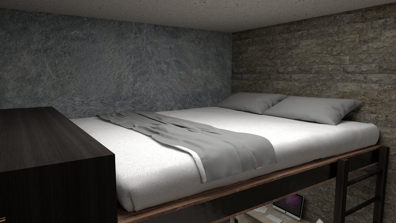 Lit mezzanine adulte avec bureau intégré en bois dans une chambre moderne